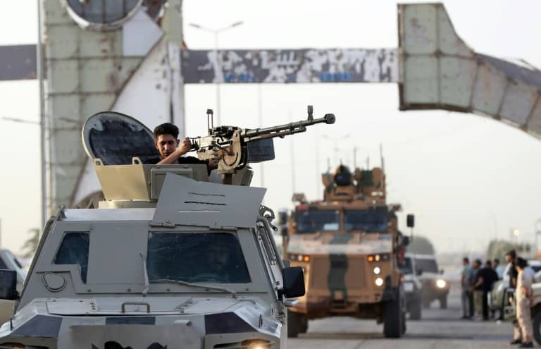 Joint forces affiliated with Libya's Government of National Unity assemble inside the closed Tripoli International Airport