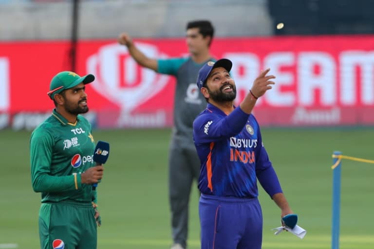 Pakistan captain Babar Azam (L) won the toss and put India captained by Rohit Sharma