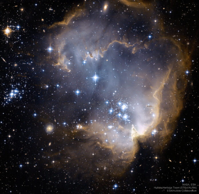 NASA Astronomy Picture of the Day: NGC 602 and Beyond — 2026-04-13